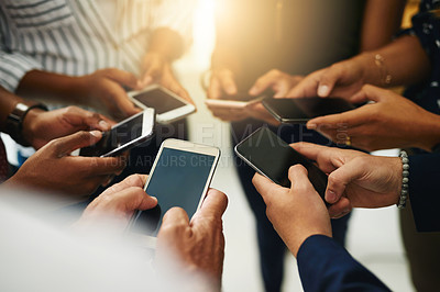 Buy stock photo Business people hands typing on a phone, closeup texting on social media or reading emails or online news. Diverse group of colleagues social networking, looking at copyspace mobile screens.

