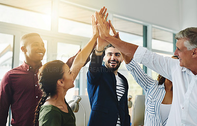 Buy stock photo Corporate businesspeople celebrate success in an office. Passionate people feeling motivated, confident and cheerful. Excited, smiling and diverse professional group happy with their big win.