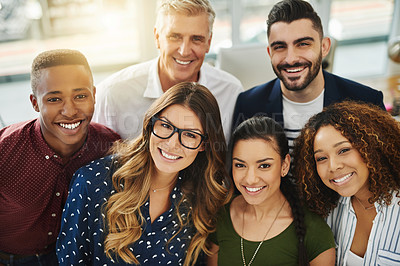 Buy stock photo Teamwork, smiling and diverse workers standing together in a creative workplace. Portrait of group of casual businesspeople and colleagues looking happy. Team of professionals ready for collaboration