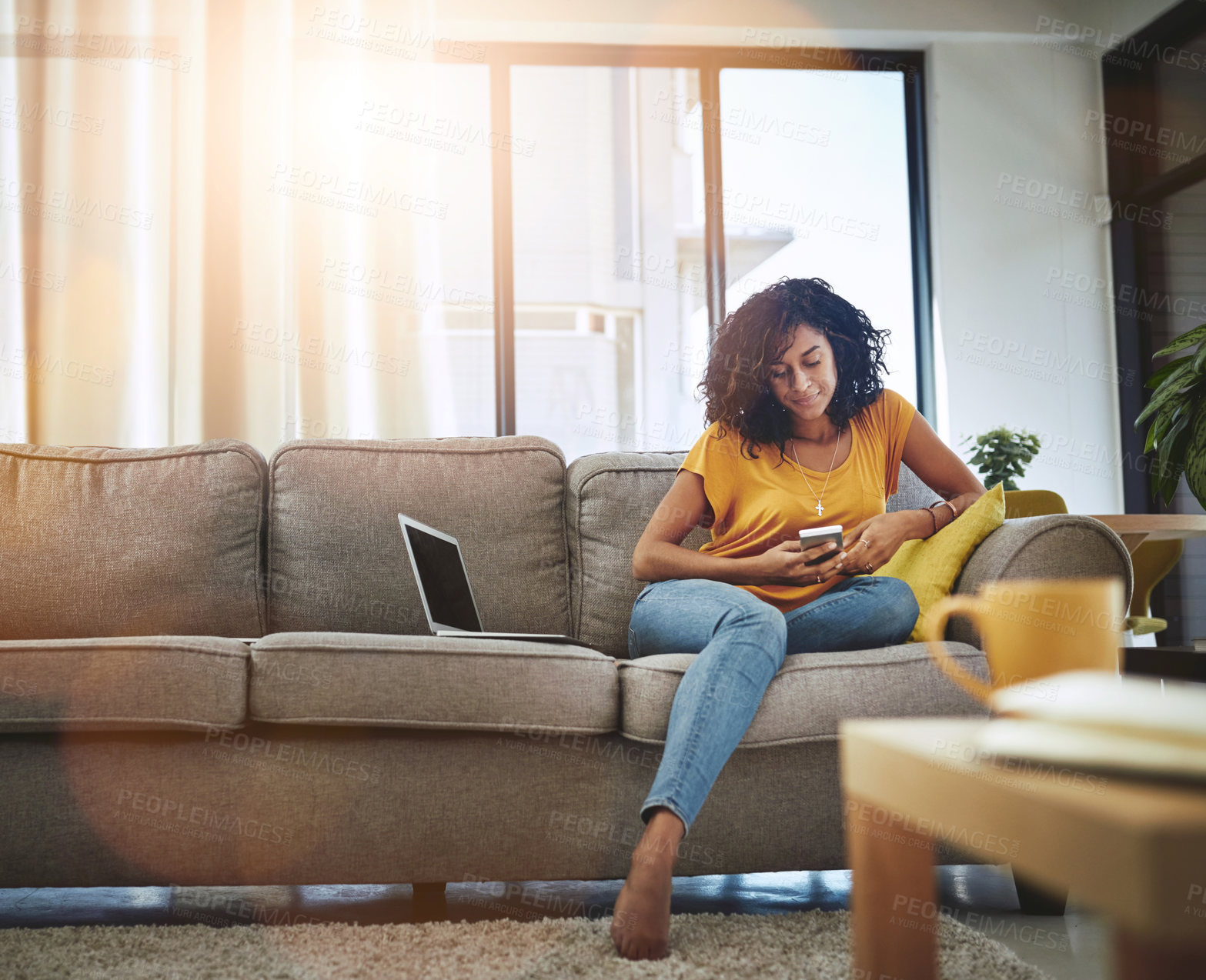 Buy stock photo Relax, home and woman with a smartphone, typing and connection with social media, communication and digital chatting. Female person, laptop and girl on a couch, cellphone and mobile app for texting