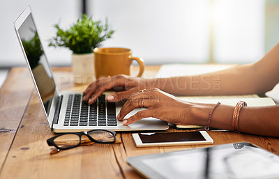 Buy stock photo Shot of an unrecognizable woman working from home