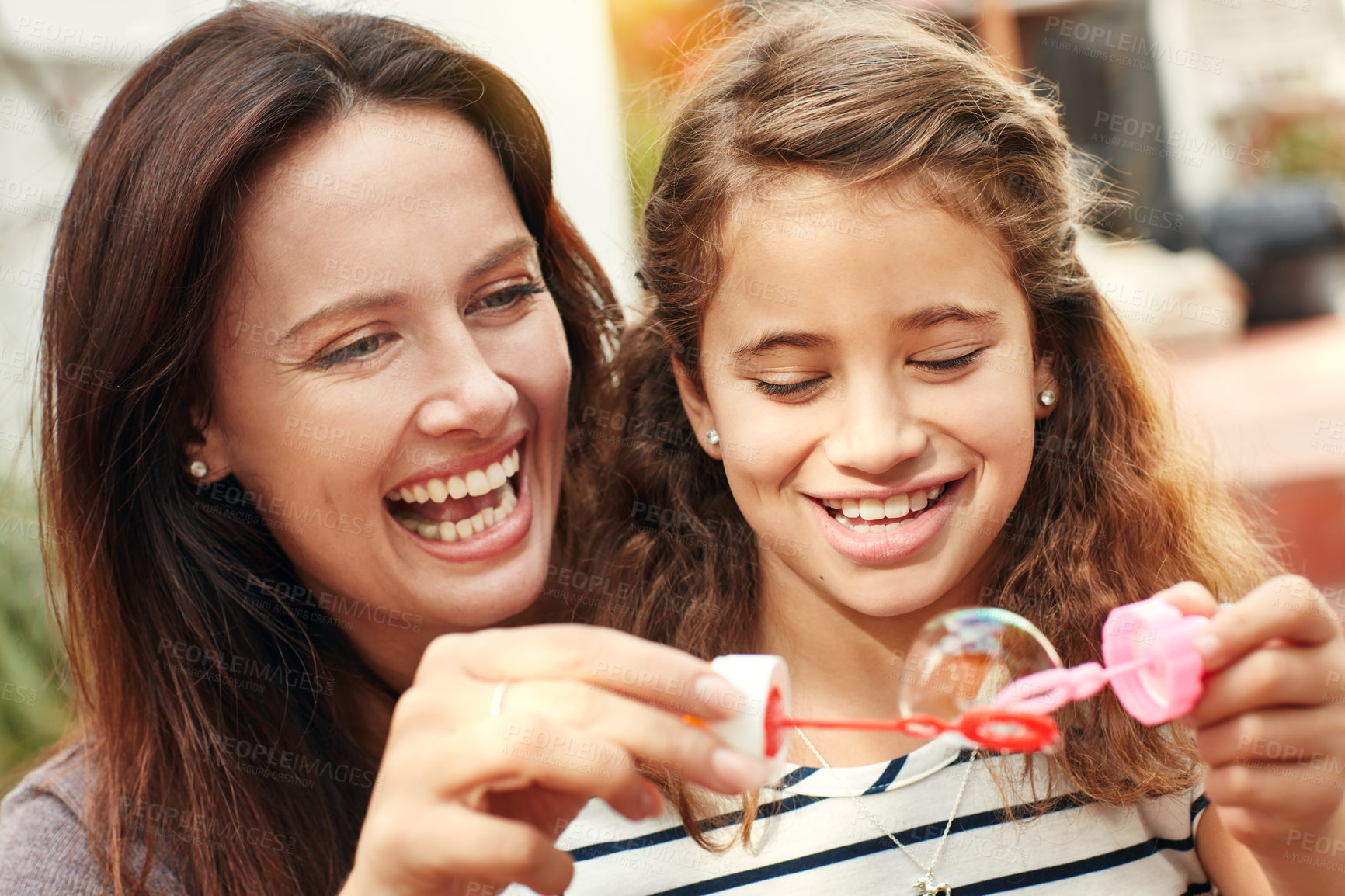 Buy stock photo A happy mother and daughter spending time together outdoors
