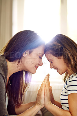 Buy stock photo Shot of a happy young mother and daughter enjoying their time together