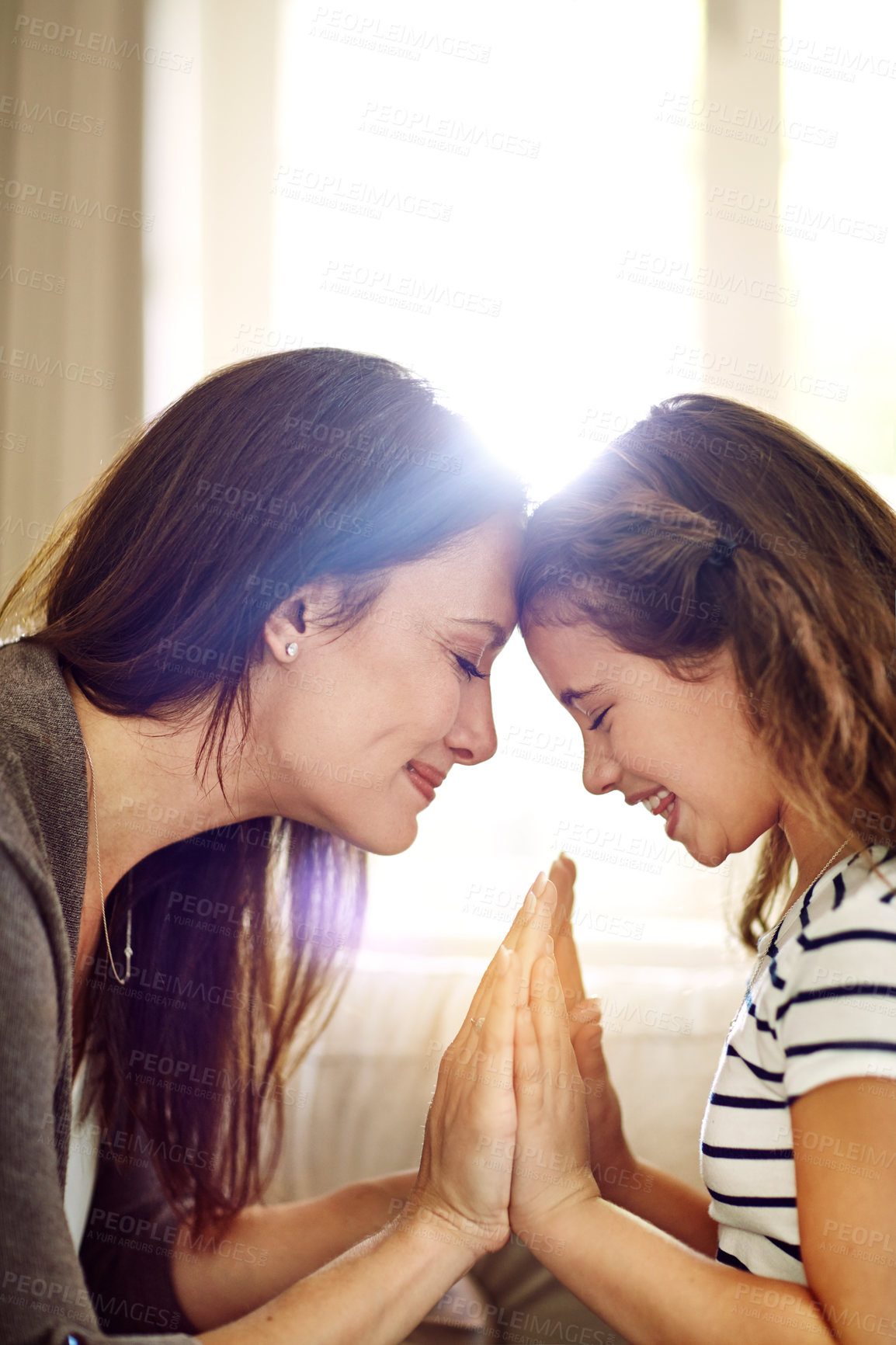 Buy stock photo Shot of a happy young mother and daughter enjoying their time together