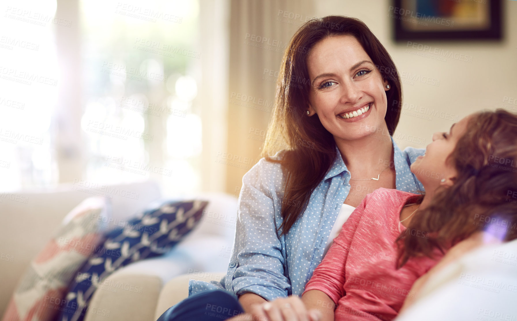 Buy stock photo Shot of a beautiful mother and her adorable daughter bonding at home