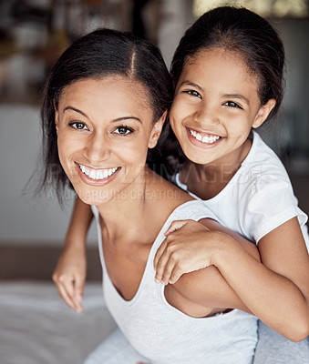 Buy stock photo Portrait of a mother and her little daughter bonding together at home