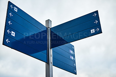 Buy stock photo Travel, arrow and road sign outdoor for direction, location and building guide in city with mockup. Street, symbol and infrastructure for drive, way and path in urban town with pole, safety and route