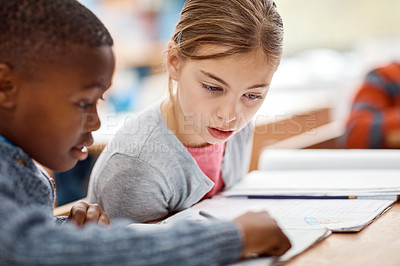 Buy stock photo Shot of elementary school kids working together in class