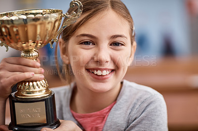 Buy stock photo Portrait of an elementary school girl holding a trophy in class