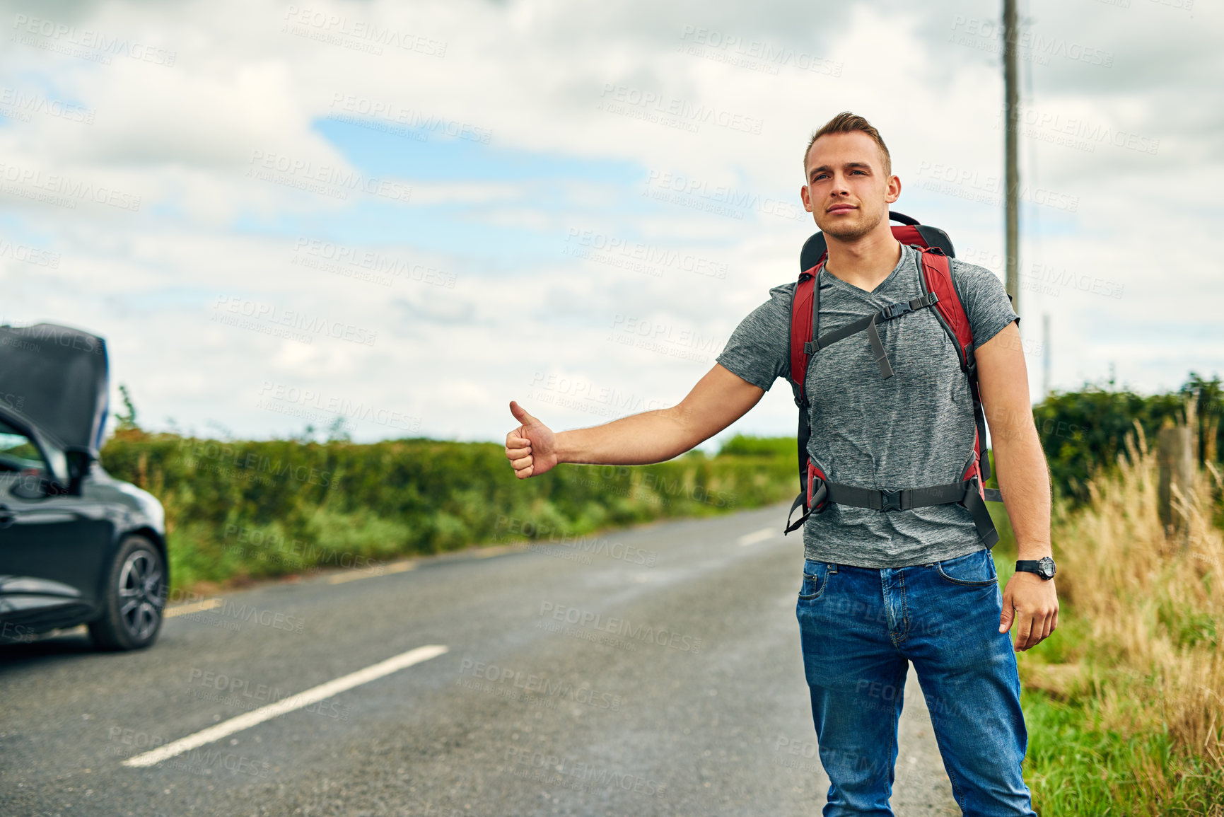 Buy stock photo Breakdown, car and roadside assistance with man hitchhiker outdoor in countryside for travel. Hand gesture, highway and transport with unhappy person on asphalt street for adventure, journey or help