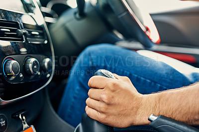 Buy stock photo Closeup shot of a driver changing the gears of a motor vehicle