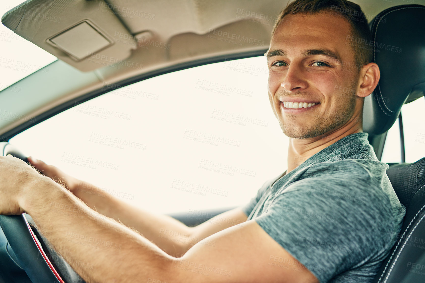 Buy stock photo Portrait of a young man driving a car