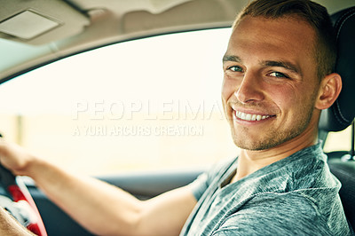 Buy stock photo Portrait of a young man driving a car