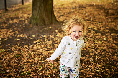 Buy stock photo Shot of an adorable little girl having fun outdoors