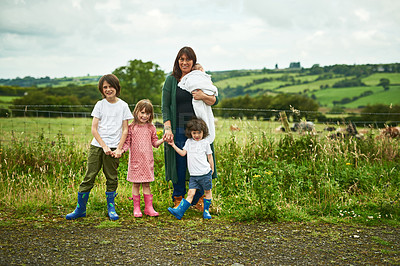 Buy stock photo Portrait, family and kids with mother outdoor for love, care or holding hands together. Mom, children and siblings with baby in countryside for support, connection or people bonding on summer holiday