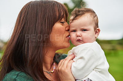 Buy stock photo Mother, baby and kiss in backyard for love, care and development for trust. Mom, child portrait and affection outdoors for security, childcare and family in garden for support and wellness at home