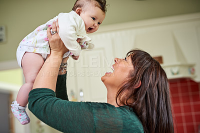 Buy stock photo Love, playing and mother with baby in home for bonding, connection or family time together. Excited, sweet and happy mom holding cute infant kid for early childhood development or growth at house.