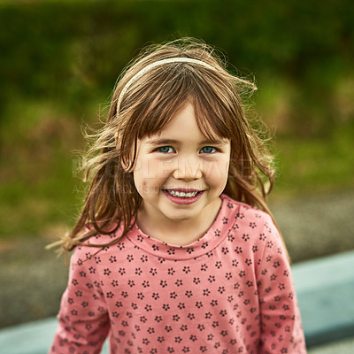 Buy stock photo Portrait of an adorable little girl having fun outdoors