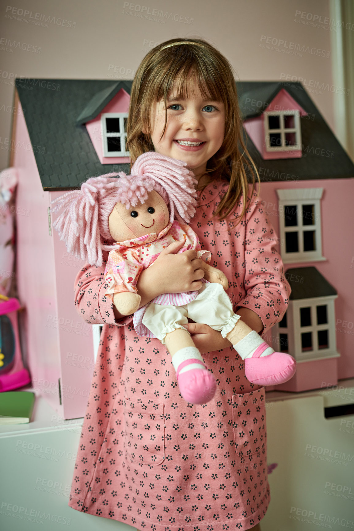 Buy stock photo Portrait of an adorable little girl playing with her toys at home