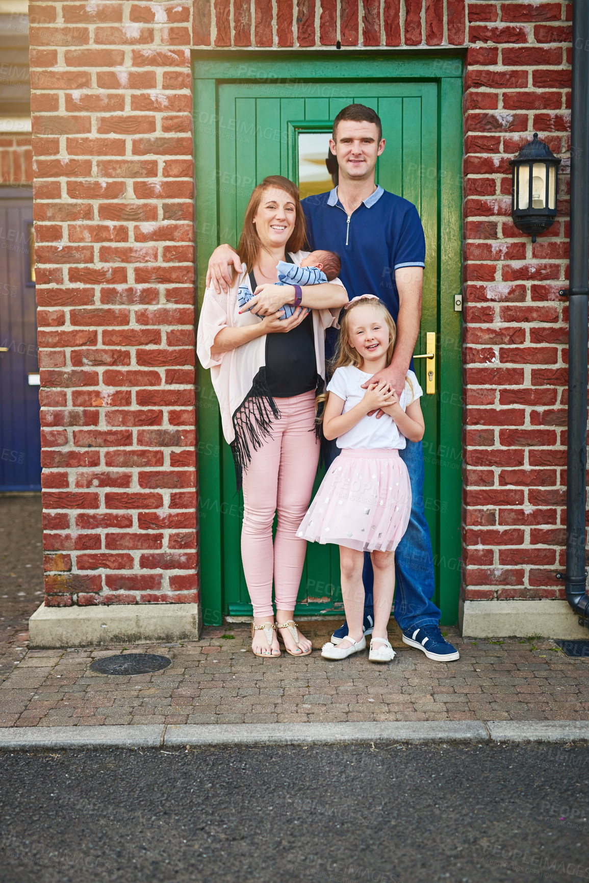 Buy stock photo Family, home or portrait at front door for love, security or happy at brick wall. Parents, children or smile at house for support, bonding or pride for investment opportunity or real estate purchase