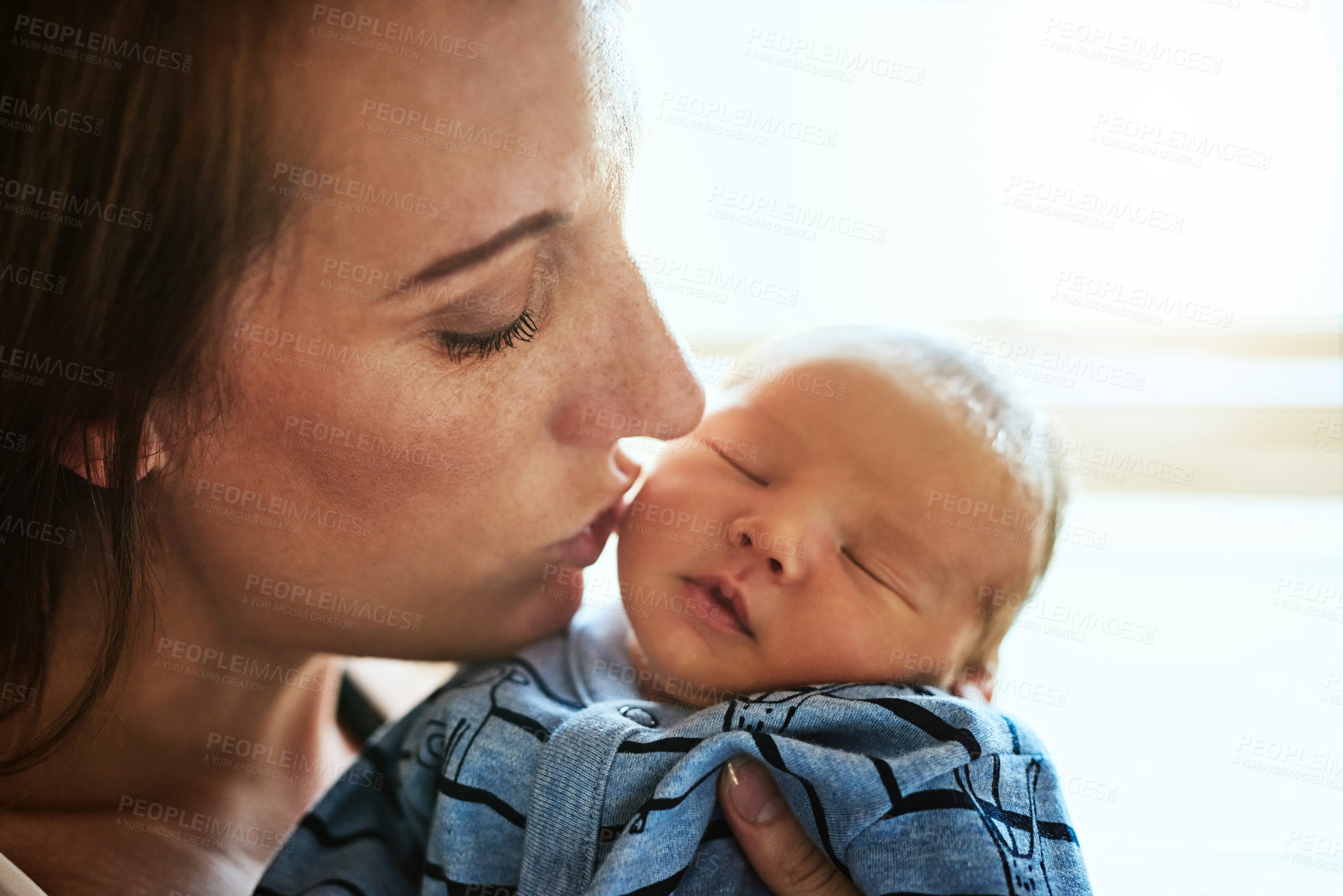 Buy stock photo Mother, kiss and newborn baby in home, sleeping and support child for development in dream. Mom, nap and holding kid for relationship connection by bonding, affection and love for infant or care