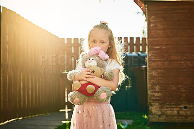 Buy stock photo Girl, child and outdoor portrait with teddy bear, playing games and toy for fantasy adventure. Female person, kid and backyard freedom for development, together and friend for safety or bonding hug