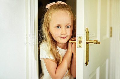 Buy stock photo Door, happy and portrait of child in home for playing game, hide and seek or having fun. Smile, cute and young girl kid opening bedroom entrance for hiding with hobby at house in Switzerland.