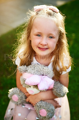 Buy stock photo Girl, kid and outdoor portrait with teddy bear, playing games and toy for fantasy adventure. Female person, love and backyard freedom for development, together and friend for safety or bonding hug