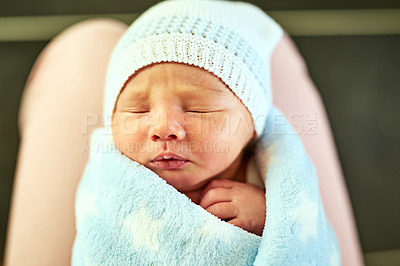 Buy stock photo Shot of a tired little baby boy sleeping with his  eyes closed while his mother holds him in her hands at home