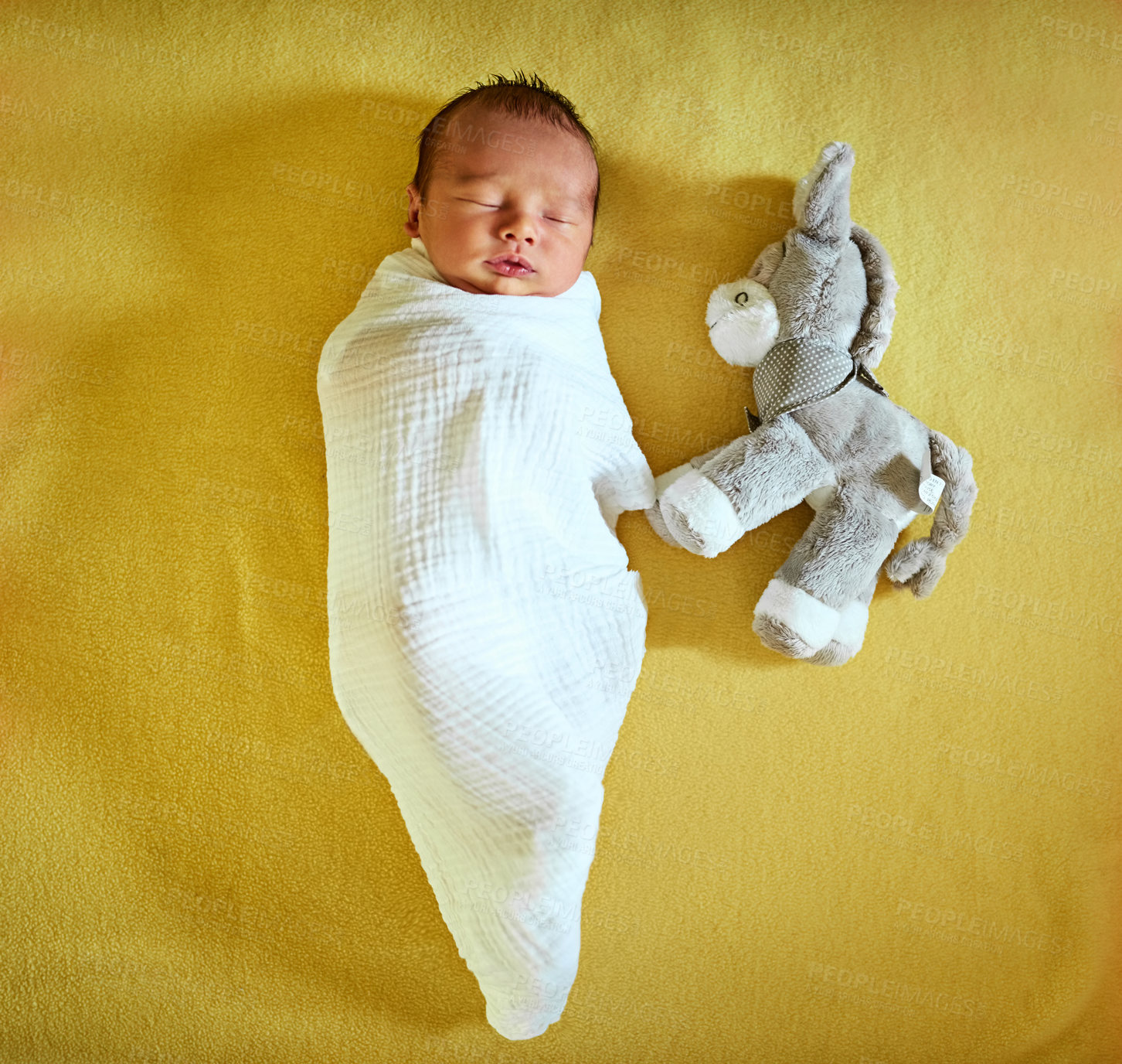 Buy stock photo Sleeping, toy and above of baby on yellow background for child development, wellness and growth. Adorable, cute and newborn resting, tired and nap for comfort, dreaming and blanket in nursery