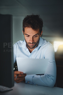 Buy stock photo Businessman, reading and night at office with documents for finance, accounting or project. Man, employee or accountant working late with notes, paperwork or financial business plan at workplace