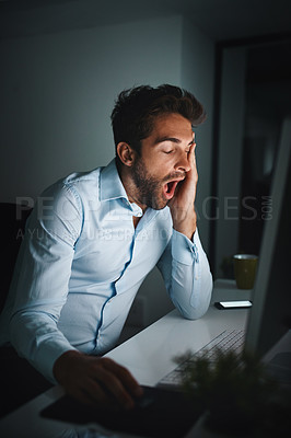 Buy stock photo Man, tired and yawning in office with computer for coding, programming and software development at night. Business fatigue, late or night for information technology and engineer with burnout in dark