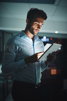 Buy stock photo Businessman, night and browsing with tablet for research, networking or checking connectivity at office. Man, employee or tech support working late on technology for internet connection at workplace
