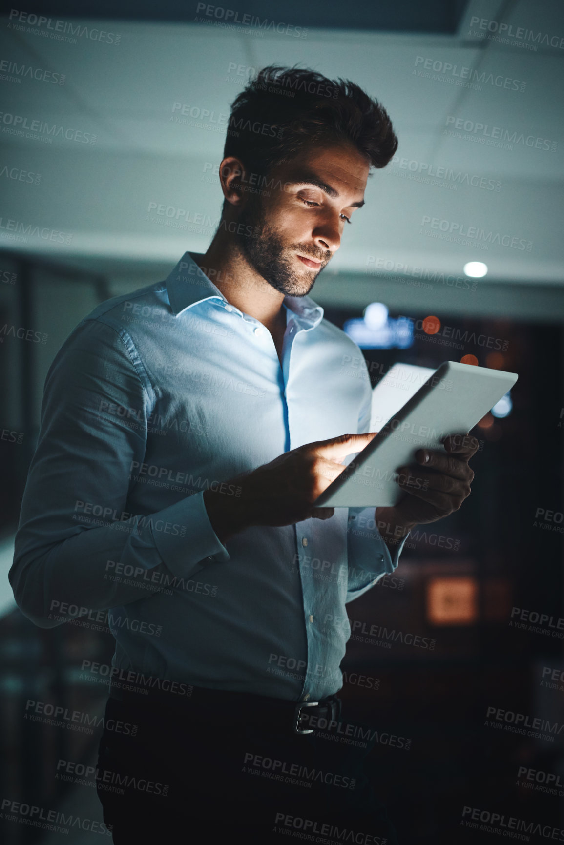 Buy stock photo Businessman, night and browsing with tablet for research, networking or checking connectivity at office. Man, employee or tech support working late on technology for internet connection at workplace
