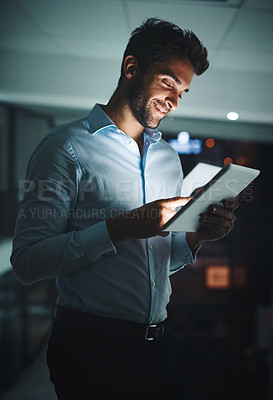 Buy stock photo Happy, businessman and night with tablet for research, networking or tech support at office. Young man, employee or IT specialist working late on technology for online maintenance at workplace