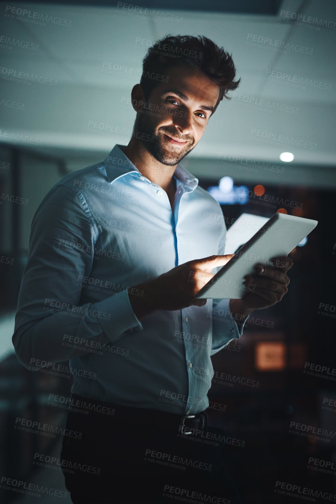 Buy stock photo Businessman, portrait and night with tablet for research, networking or tech support at office. Young man, employee or IT specialist working late on technology for online maintenance at workplace