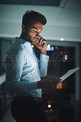 Buy stock photo Night, tablet and phone call with a business man in the office to research information for a project. Communication, networking and contact on a mobile with a male employee working in the evening