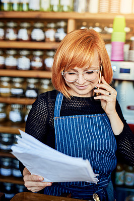 Buy stock photo Woman, phone call and order at coffee shop with documents, thinking and smile for price, stock and deal. Barista, smartphone and paperwork for invoice, inventory and contact supplier in cafeteria