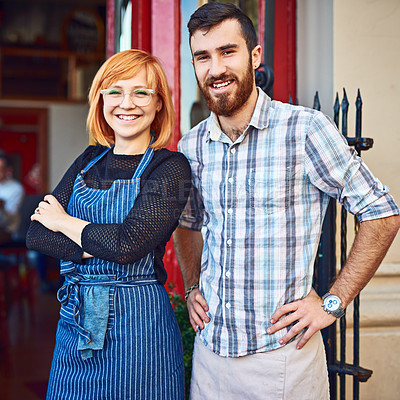 Buy stock photo Shot of co-owners standing outside their coffee shop