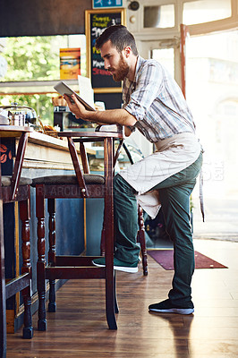 Buy stock photo Coffee shop, waiter and man on tablet for online menu, check stock and product inventory. Restaurant, small business and person on digital tech for cafe website, networking and research by counter