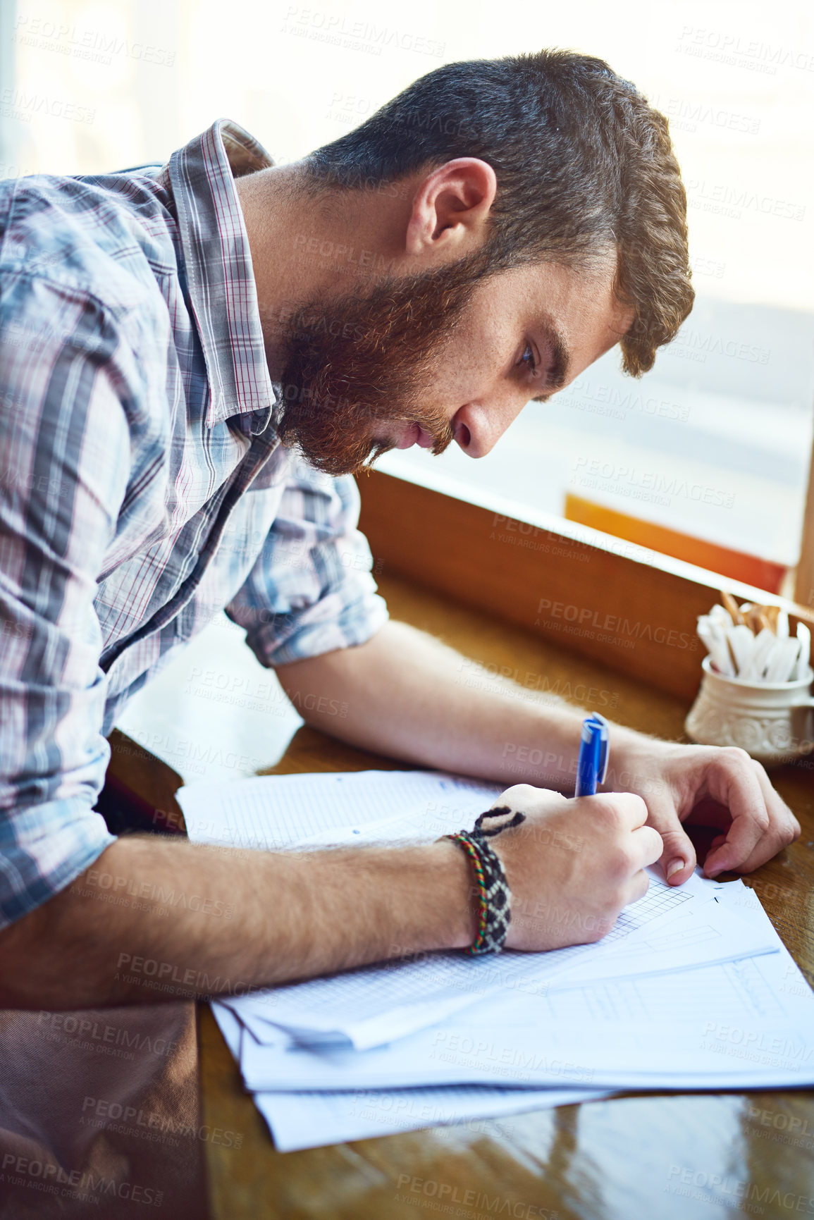 Buy stock photo Business, man and owner with documents at cafe for writing finance planning, vendor contract and inventory budget. Person, paperwork and customer feedback form, sales profit and reading information