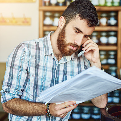 Buy stock photo Man, phone call and shop owner in cafe with paperwork, thinking and reading for price, stock and deal. Barista, smartphone and documents for invoice, inventory and contact supplier in restaurant