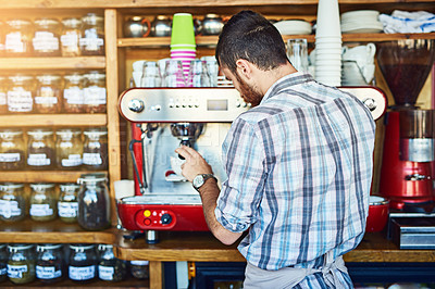 Buy stock photo Cropped shot of a barista making coffee