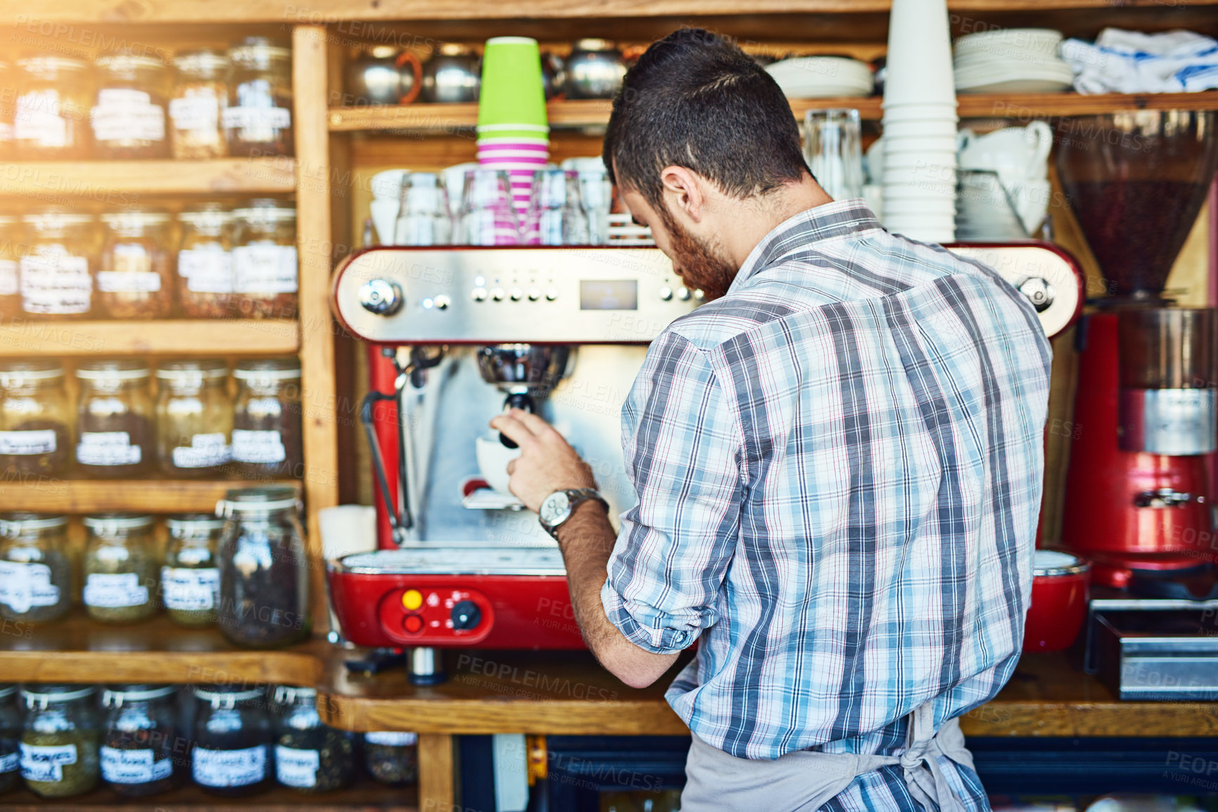 Buy stock photo Coffee, machine and man in cafe with cup for morning drink, wellness and service at small business. Relax, hospitality and barista in restaurant with espresso, latte or cappuccino process from back