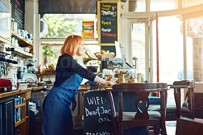 Buy stock photo Portrait of a confident young woman woman working in a coffee shop
