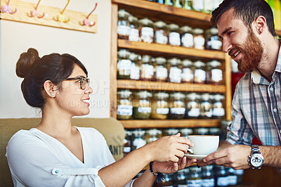 Buy stock photo Cafe, woman and man with coffee, service and waiter with smile for customer, happy or relax in morning. Hospitality, serving and people with tea, glasses and flirting in store or  love at first sight