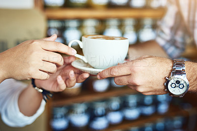 Buy stock photo Shot of an unrecognizable woman receiving a cup of coffee from an unrecognizable waiter at a cafe