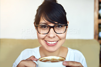 Buy stock photo Shot of a beautiful young woman drinking a cup of coffee in a cafe