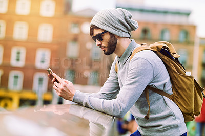 Buy stock photo City, travel and man with smartphone on balcony for research, communication and search of location. Internet, male person and backpack with tech for outdoor journey, information and tourism in London