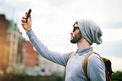 Buy stock photo Man, selfie and outside for travel in city, social media and post with connection with internet in urban downtown. Belgium, outdoor and photography or tourist blog, holiday and weekend on app